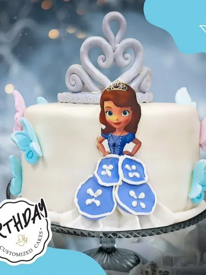 A charming Princess Sofia cake with a fondant crown and butterfly accents. The design is simple, elegant, and perfect for a little one who dreams of being a princess.