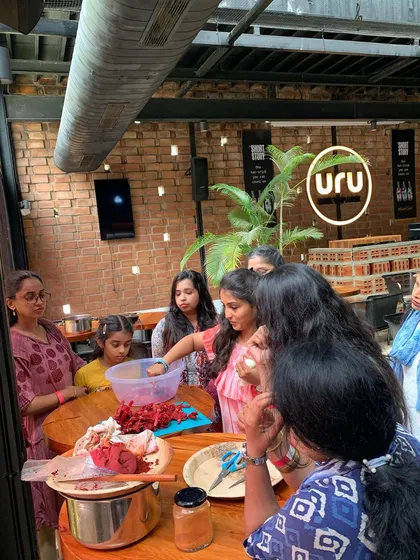 A group of participants learning how to prepare the natural dye bath. It's a hands-on process from start to finish, connecting everyone to the ancient craft of dyeing.