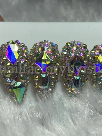 For those who love extreme bling. A full set of press-on nails completely covered in iridescent crystals.