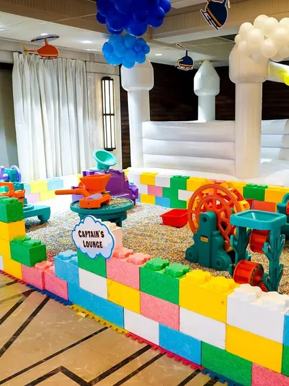 We design unique play areas like this Sensory Sand Pit, enclosed by colorful Lego-style blocks. It provides a safe and engaging tactile experience for younger children at indoor or outdoor parties.