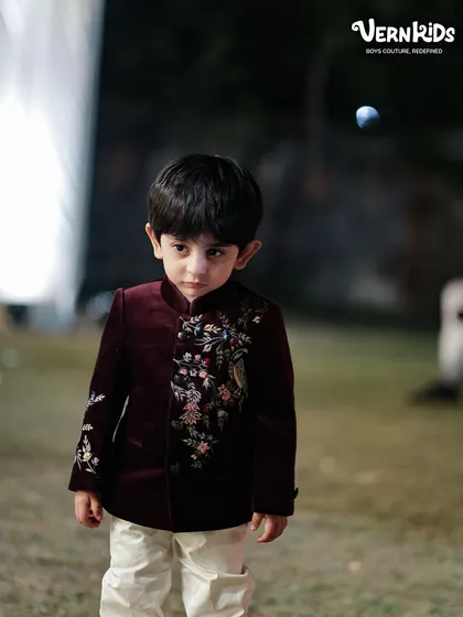 Another look at our custom-tailored Indo-western outfits. This little client looks thoughtful and stylish, ready for any grand family event.