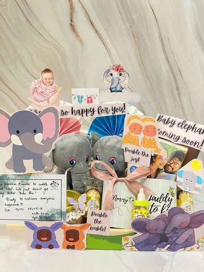 Double the joy, double the trouble! This adorable elephant-themed hamper was created for parents-to-be expecting twins, complete with two plush elephants and 'Mommy to be' and 'Daddy to be' mugs.