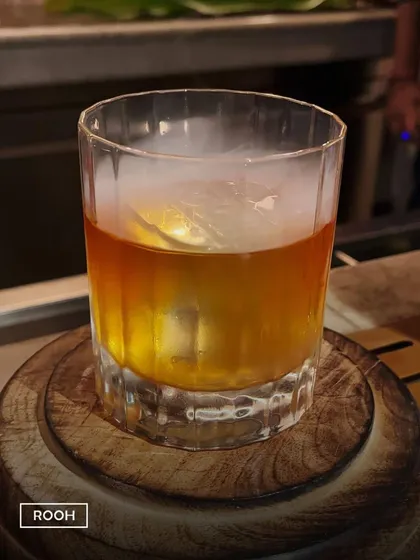 Experience whiskey artistry where smoke swirls and flavors deepen. This Butter Old Fashioned is infused with smoke for a smooth, complex, and unforgettable taste.