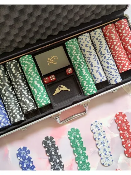 Another example of a custom poker set, this one featuring a unique wing logo on the chips and dealer button.