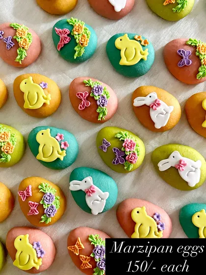 Here's a look at my handmade marzipan Easter eggs. Each one is a different pastel color and decorated with tiny, delicate sugar-paste bunnies, chicks, and flowers.