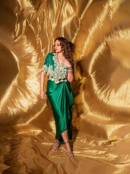 For the 'Heeramandi' promotions, we styled Sonakshi Sinha in this regal green draped ensemble by Anamika Khanna. The look, complete with intricate embroidery and traditional jewelry, was designed to reflect the grandeur of the series.