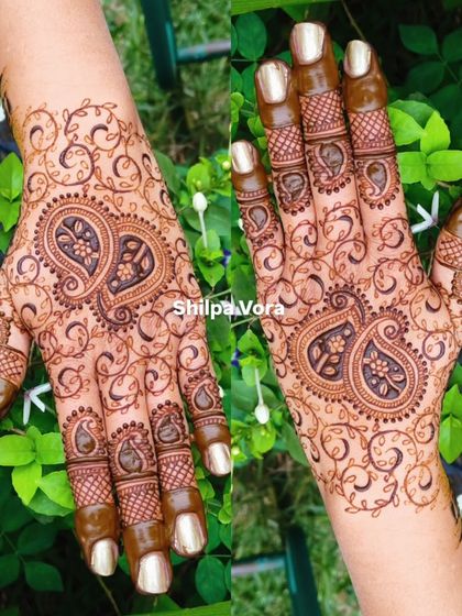 A mirrored image of a beautiful paisley design surrounded by delicate vines, creating a full and balanced look.