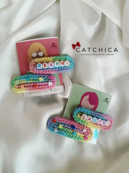 Another view of the 'Reanna' and 'Laura' name clips, showing how they look against a clean, white background. The colors are so bright and cheerful.