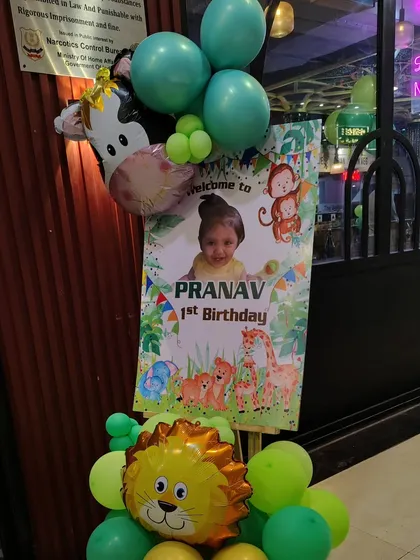 Here is a custom welcome stand I made for a jungle-themed first birthday. It's a great way to greet guests as they arrive at the party venue.
