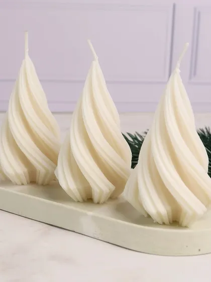 White Christmas. Our spiral tree candles look elegant and modern on a trinket tray.