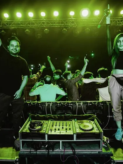 Posing with my talented friend DJ Perisha during a performance. I love collaborating with other artists in the industry to create unique and dynamic shows.