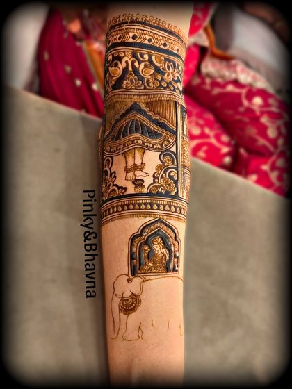 This arm design combines a dancing figure with a depiction of a god inside a jharokha, carried by an elephant, showcasing our skill in thematic storytelling.