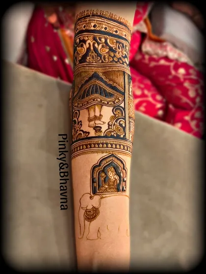 This arm design combines a dancing figure with a depiction of a god inside a jharokha, carried by an elephant, showcasing our skill in thematic storytelling.