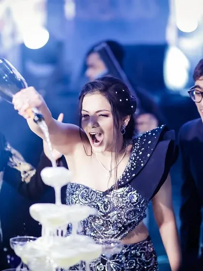 The classic champagne tower pop. A moment of pure celebration and excitement at a cocktail party.