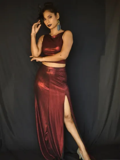 A dynamic pose showing the complete high-fashion outfit and makeup, demonstrating my ability to create looks for fashion shoots.