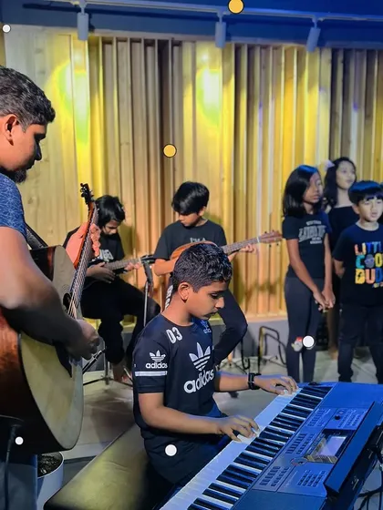 A group of our younger students rehearsing together with their instructor. This is where it all starts: learning to play as an ensemble.