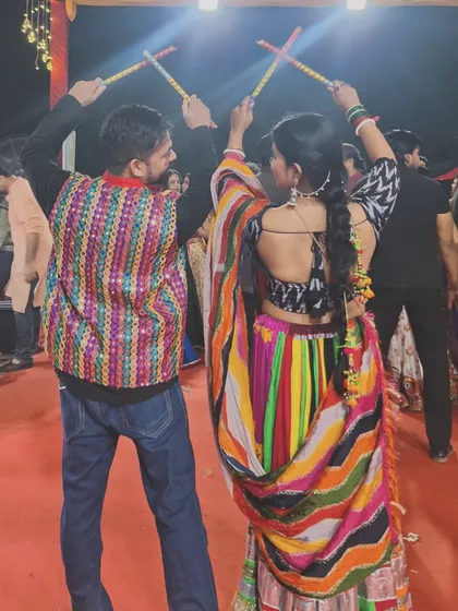 Striking a classic Dandiya pose together. We love teaching and participating in these traditional dance forms, bringing people together to celebrate our vibrant culture.