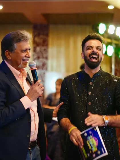 Sharing a laugh on stage while hosting an annual day for Quess Corp. I have hosted over 10 shows for them since 2017, and they feel like family now.