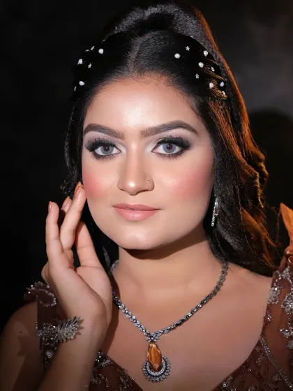 A close-up of a soft glam look, perfect for any special occasion. The focus is on the flawless skin and the beautifully blended eyeshadow.