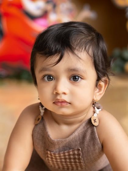 A close-up of the birthday boy during his Lion King themed shoot. His curious gaze and the detailed background create a captivating portrait.