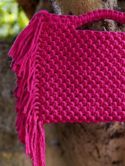 Here's a detail shot of the 'Pink Popper' bag. You can really see the tight, consistent knot work that goes into every piece. It's this attention to detail that defines my handmade accessories.