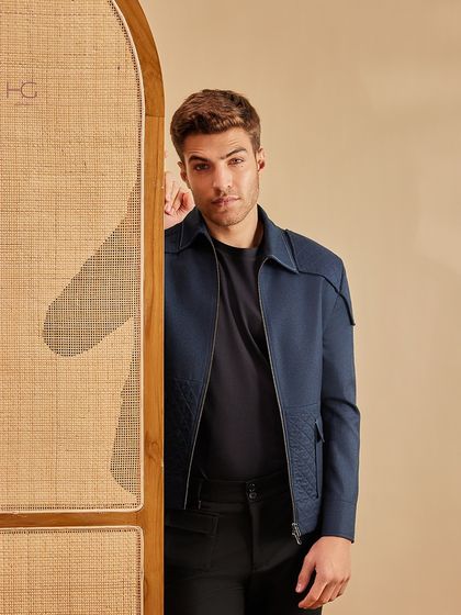 This navy zip-up shacket is the perfect layer to transition a look from casual to classy. Its sleek design and refined details add a sophisticated appeal.
