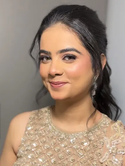 Our "Indian Barbie" look, perfect for a cocktail or reception. The makeup is soft and pretty, with a focus on flawless skin and shimmering eyes, paired with an elegant updo.