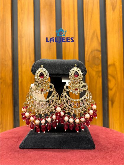 A pair of gorgeous red and white chandbali earrings. The colour is perfect for a bridal look.