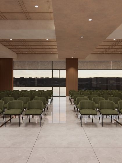 The multipurpose hall at the Shilpa Rathna Clubhouse, designed for flexibility. The neutral color scheme and simple, elegant chairs allow the space to be adapted for various community events, from meetings to celebrations.