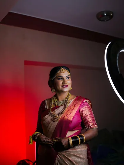 A beautiful bridal portrait taken with creative lighting. The ring light creates a lovely circular catchlight in her eyes, making the photo pop.