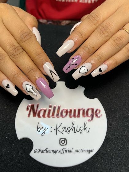 A trendy and eclectic set with a mix of nude and mauve nails, featuring hand-painted hearts and abstract line art.
