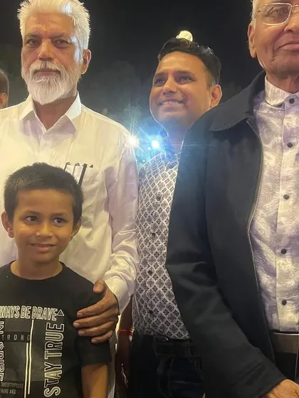 With the Hon. Minister and my father at an event. It is a blessing to share these moments with my family.