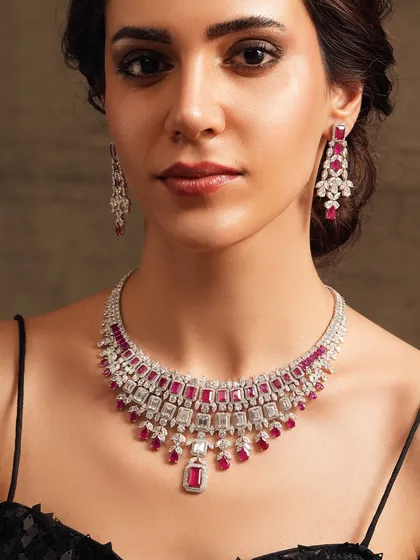 A magnificent diamond and ruby necklace, crafted for a look of pure Hollywood glamour. The intricate design and vibrant color make it a true showstopper.
