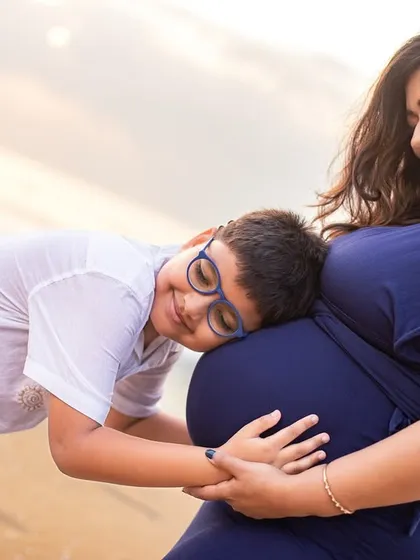There is nothing more tender than a sibling waiting to meet their new best friend. I captured this quiet moment on the beach as a big brother listens for a little secret. It’s these small, heartfelt interactions that make a maternity family session so special.