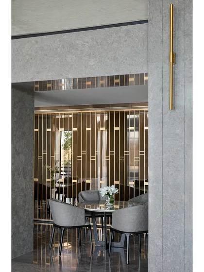 A detail shot of the decorative metal screen, which provides a visual separation while maintaining a sense of openness within the banquet space.