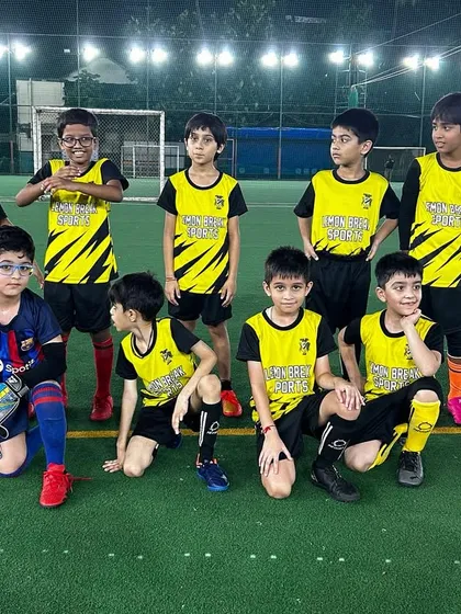 The team that plays together, grows together. A pre-match team photo of our U-9 squad, full of energy and ready for the game.