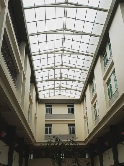 Natural light is a key material in my designs. This expansive skylight over the courtyard at the St. John's hostel block transforms the space, filtering light deep into the building and creating a bright, uplifting environment for residents.