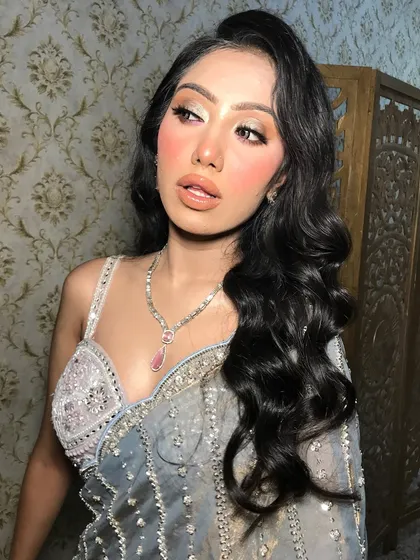 Another angle showing the beautiful waves in her hair and the sparkle of her necklace.