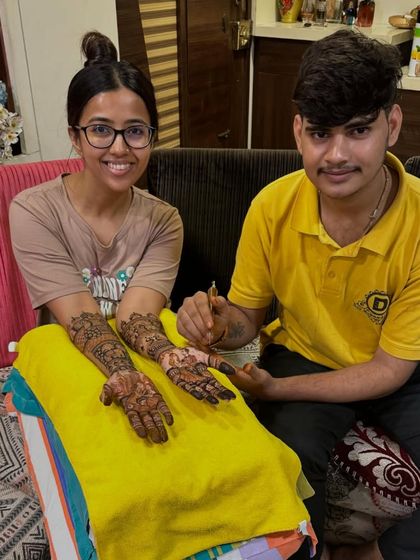 One of my artists with a client, showcasing her beautiful design.