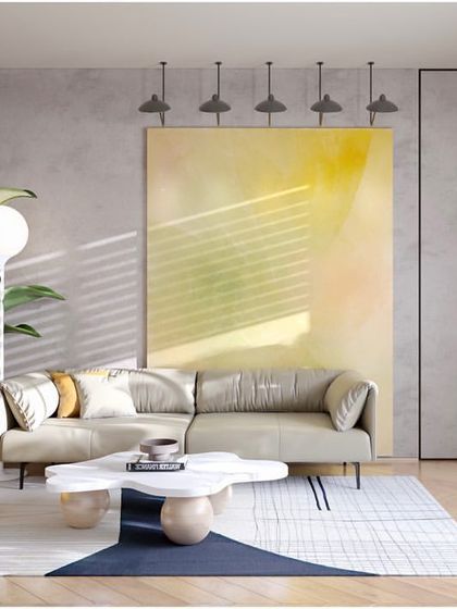 This lounge area uses a bright yellow armchair and a large, abstract painting to create a vibrant and inspiring atmosphere. It's a space designed to spark creativity and provide a visual break from the main work floor.