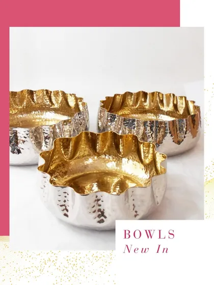 These new hammered metal bowls with a fluted rim and a golden interior are a beautiful addition to my collection. They are perfect for serving or as decorative pieces.