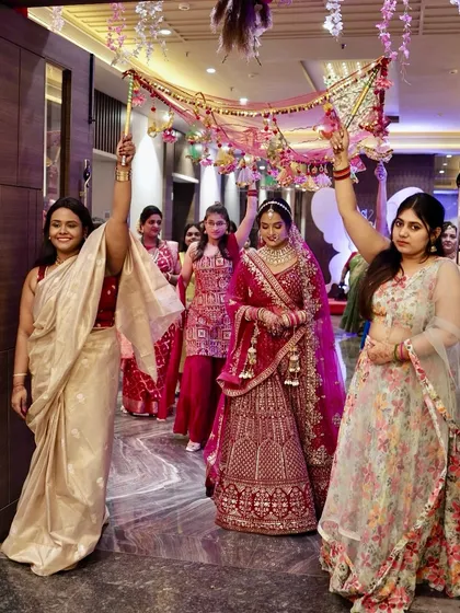 Another angle of the bride's beautiful entrance, surrounded by her loved ones.