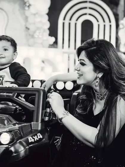 A sweet black and white moment between a mother and her son at his birthday party.