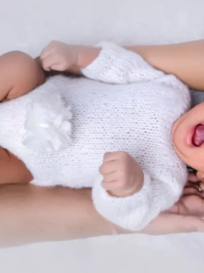 Even a tiny yawn is a moment worth remembering! We capture all the sweet, candid expressions during our newborn photography sessions.