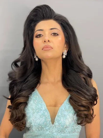 For a glamorous reception or cocktail look, I styled these big, bouncy waves. My special technique creates incredible volume and movement without any harsh crimping, so the hair looks healthy, shiny, and feels amazing.