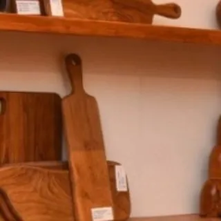 More of my handcrafted teak serving and cutting boards on display. I offer various shapes and sizes, each with a convenient handle and a smooth, durable finish.