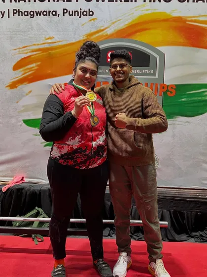 This is more than a medal; it's the result of a partnership built on trust and hard work. Standing with my athlete Pooja after she was crowned National Champion, breaking the deadlift record in the process. My role as a coach goes beyond just programming; it's about navigating challenges like her endometriosis together to achieve greatness.
