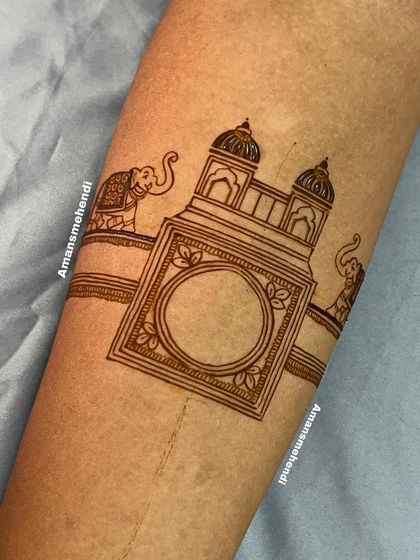 The initial outline for a grand design. This sketch shows the placement for a central swan motif, surrounded by palace architecture and elephants.