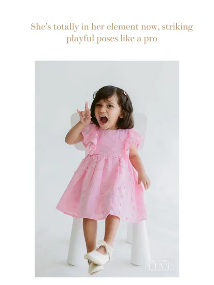 Now she's totally in her element. Once kids feel comfortable in the studio, they love to show off their fun side, striking playful poses like a little rockstar.