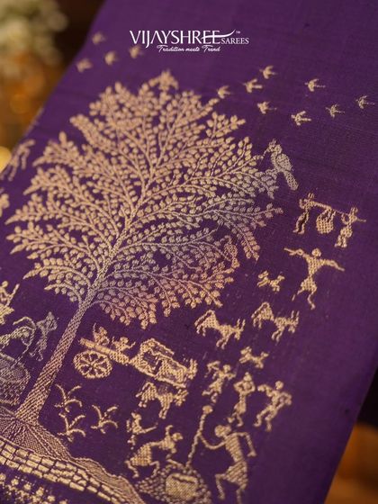 A magnificent pallu depicting the "Tree of Life" in gold zari on a purple Kanjivaram, a narrative masterpiece.